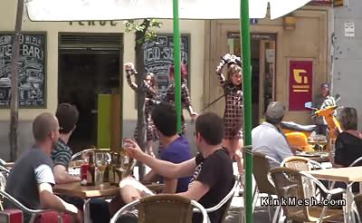 Female slaves on leash walked in public