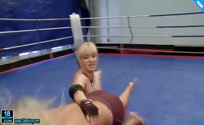 Babes wrestling naked in the ring